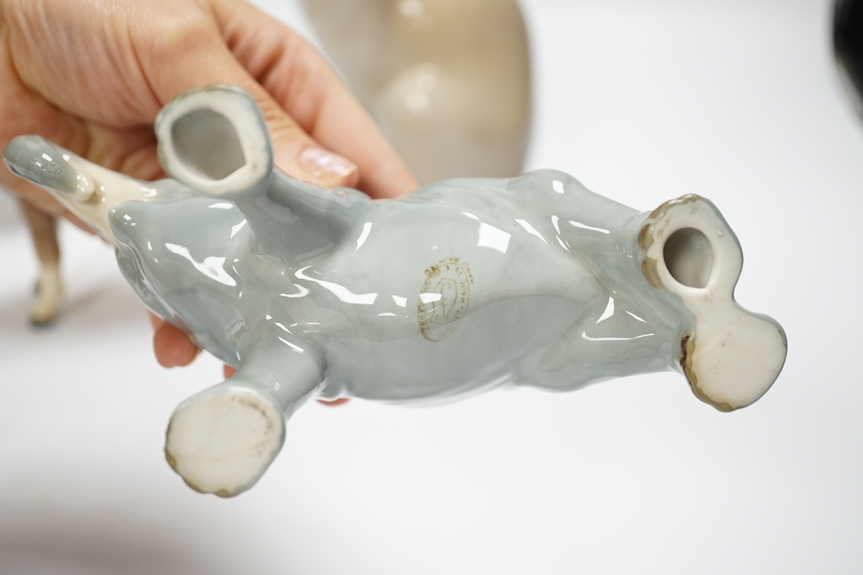 Eight animals including four Beswick, a Szeiler, a Royal Copenhagen, a cast metal cat and a Schierhols and Sohn, tallest 19.5cm